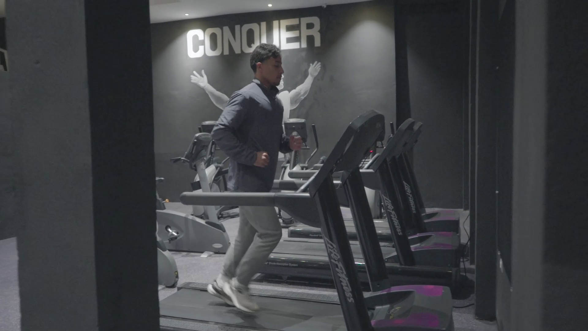 Dynamic fitness motion photography showcasing RealGym intensity